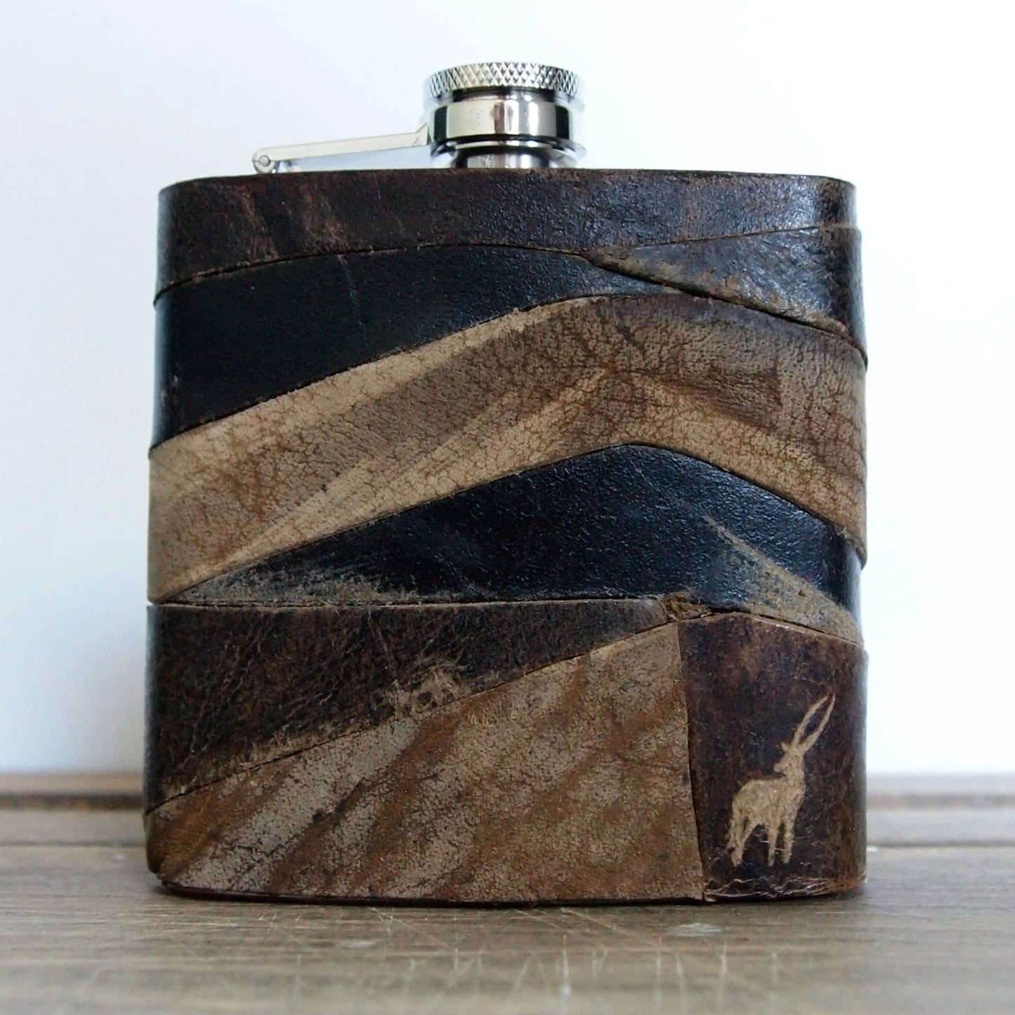 This leather whiskey flask can be personalised to include a name, text, or initial.