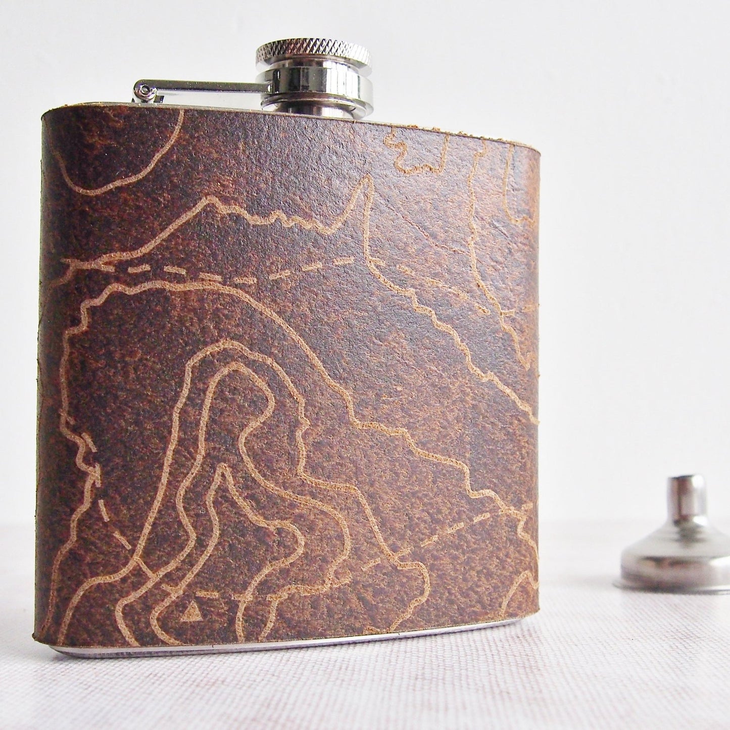 The Three Yorkshire Peaks Flask is handcrafted from high quality leather and features the engraving of the three Yorkshire Peaks.