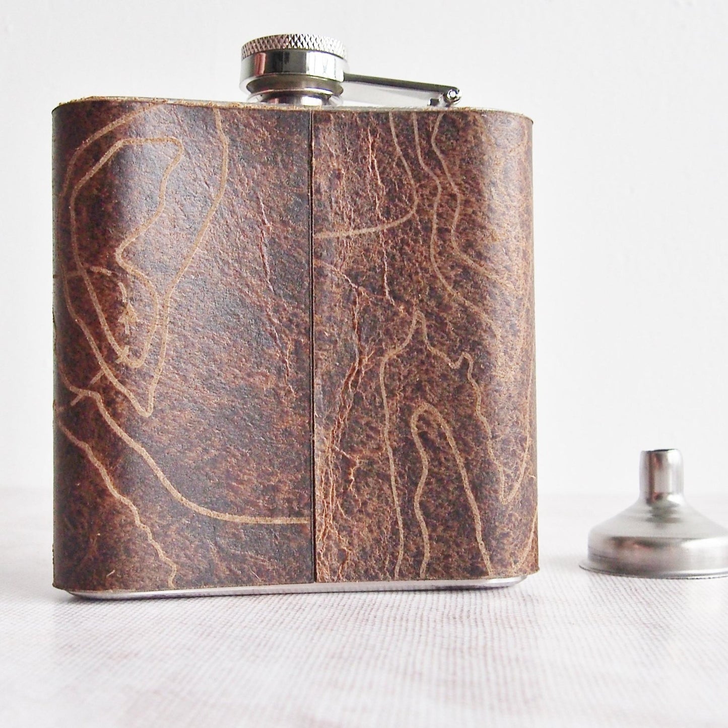 Rearview of the Three Yorkshire Peaks Flask featuring the contour lines of the three peaks.