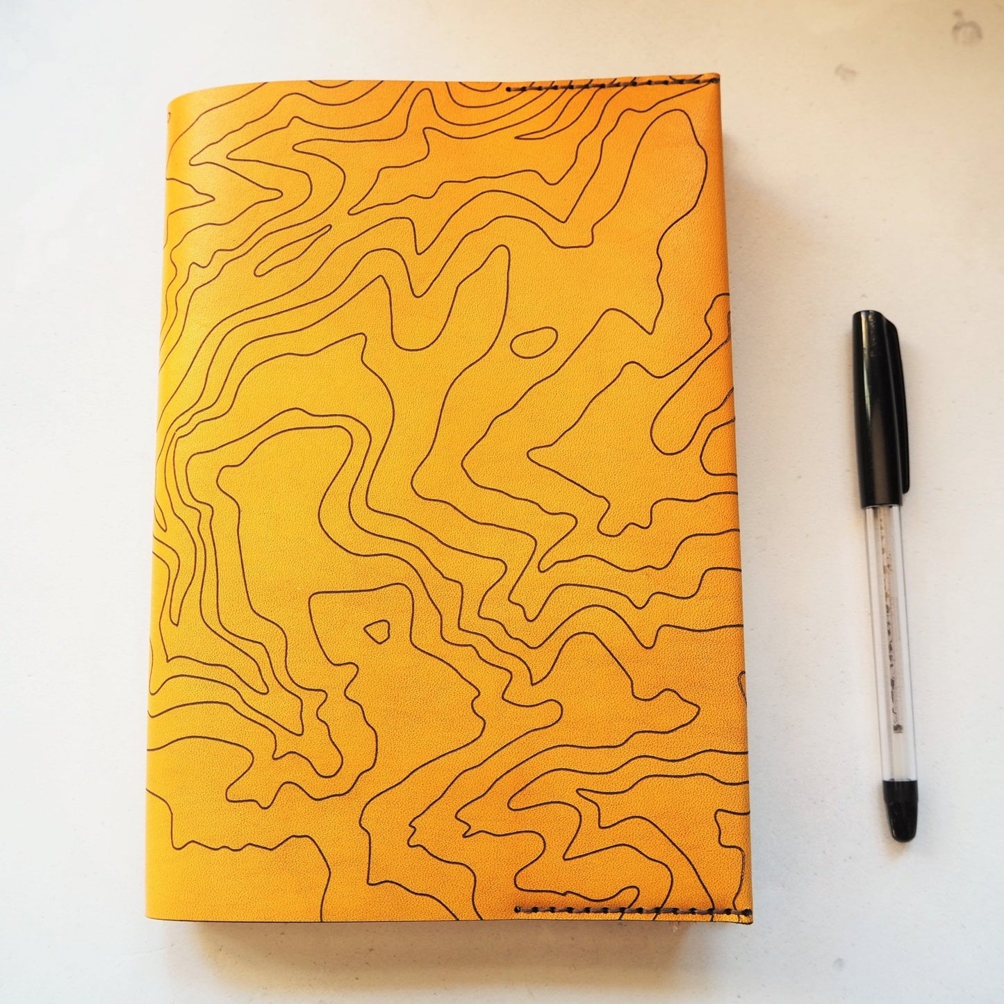The Topography Journal Cover by HÔRD featuring contour lines.