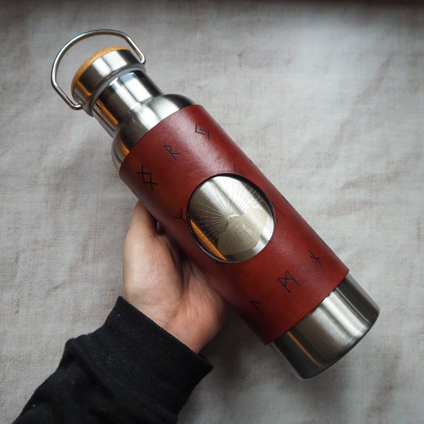A person holding the vikin bottle.