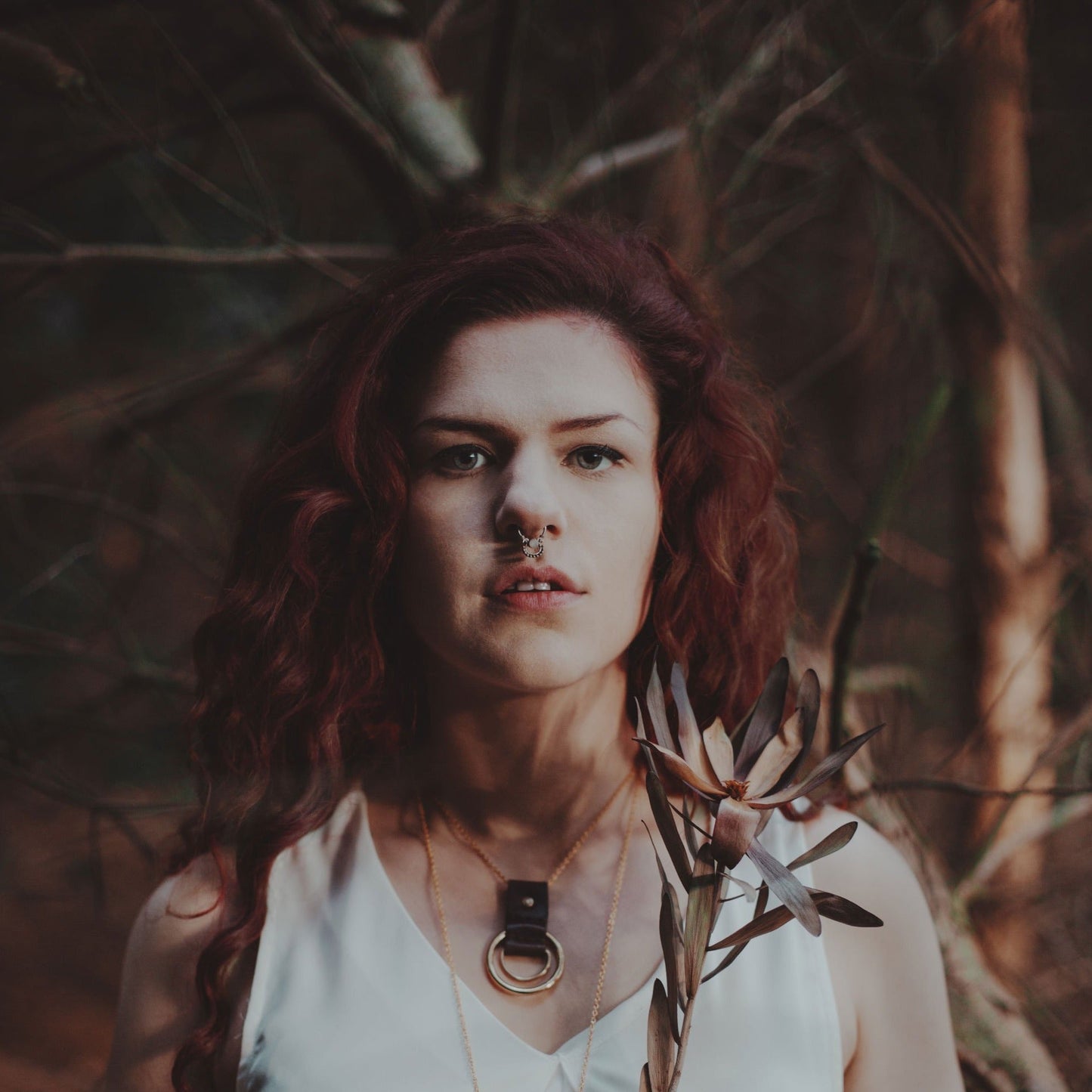 The Zenith necklace is inspired by the phases of the moon, with soft waxy leather hand stitched around a metal ring and D ring. A moon phase necklace by Hord.