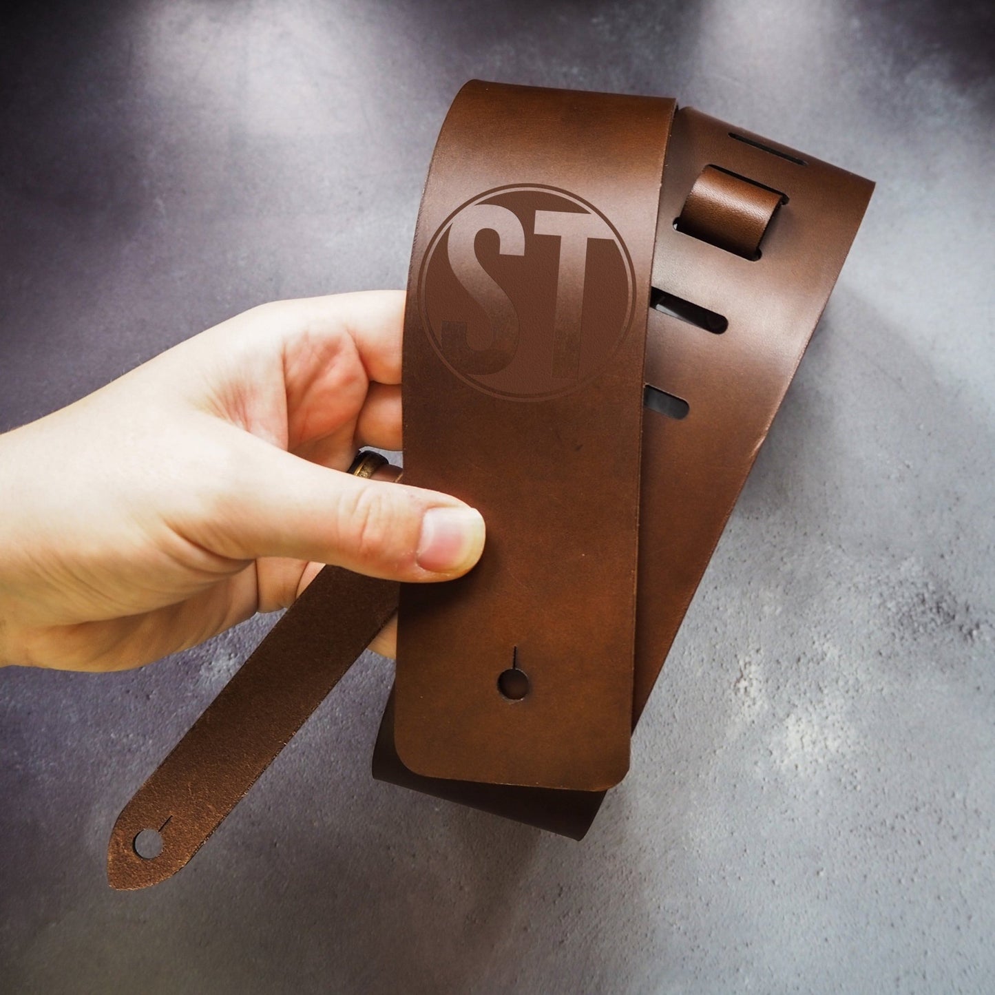 The Thick Leather Guitar Strap with Custom Logo in Brown by HÔRD.