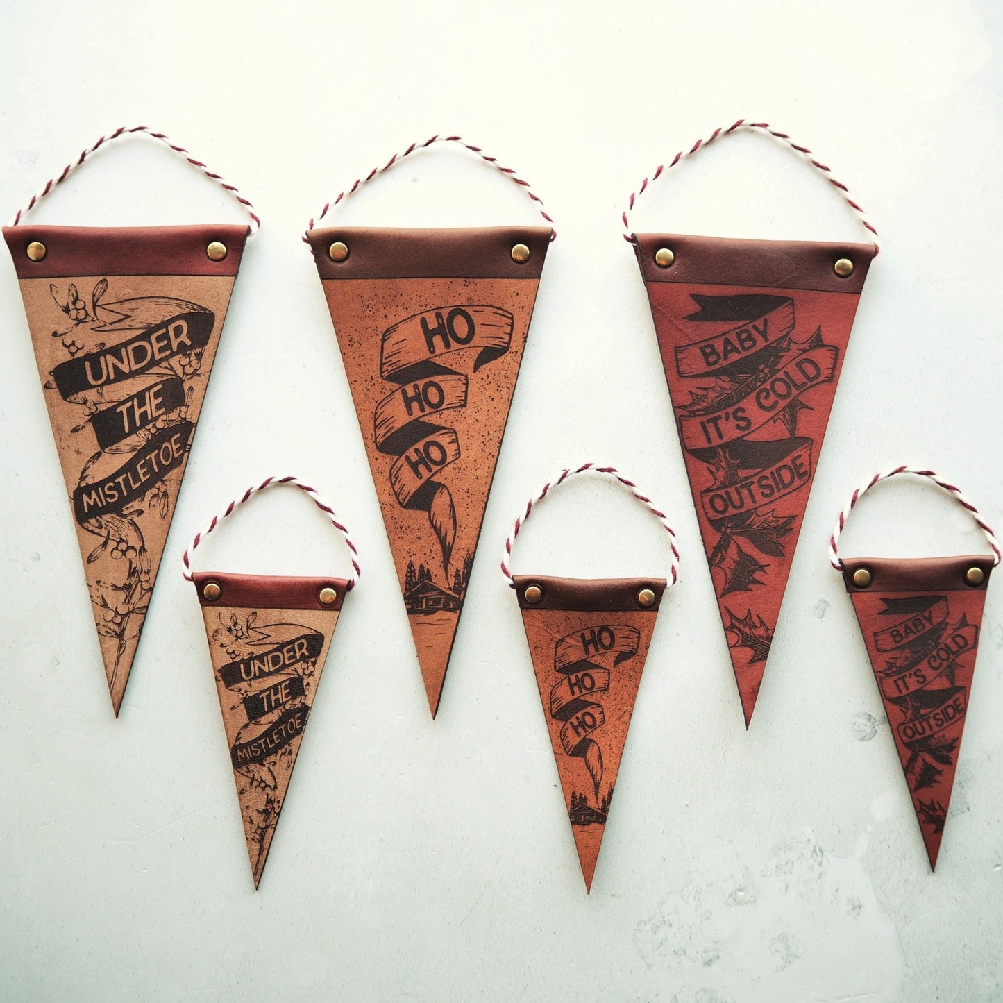 Our range of leather christmas decorations are available in 2 sizes, small and large.