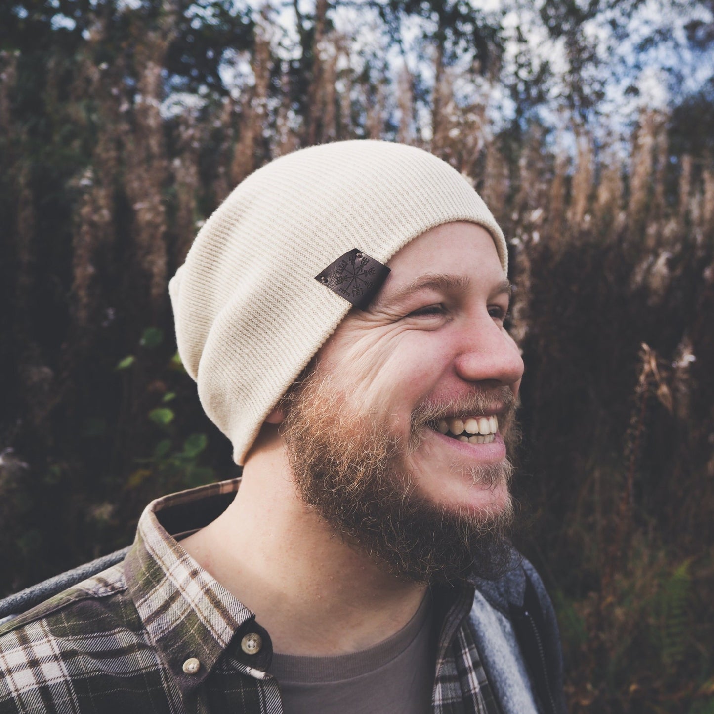 This unisex beanie from HORD, Vegvisir beanie can be worn as a slouchy beanie or folded up as a regular beanie. Pictured is the cream beanie worn in slouch style. A comfortable ans cosy accessory for colder days.