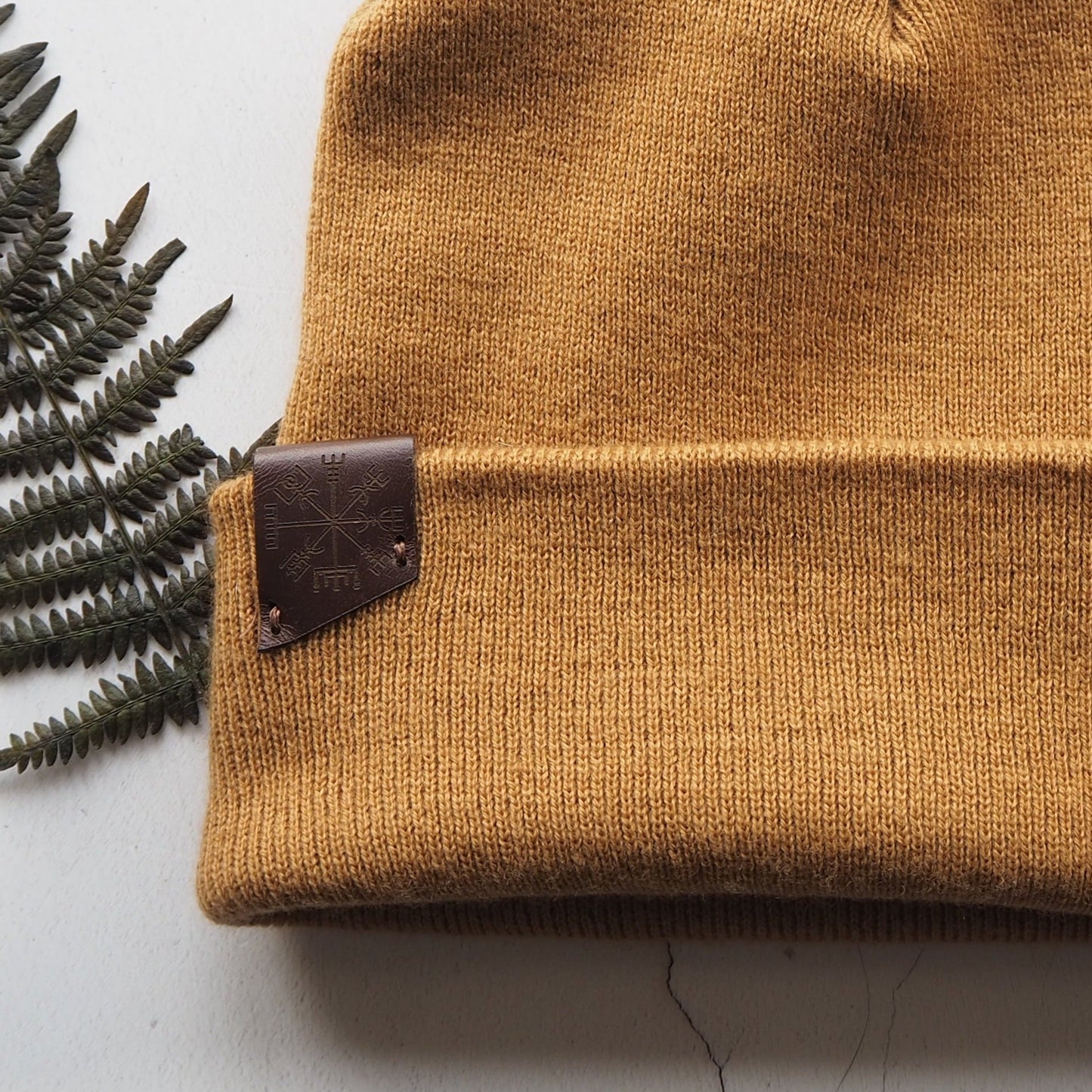 Closer look at the Vegvisir Beanie by HORD in Caramel, a unisex beanie from Hord.