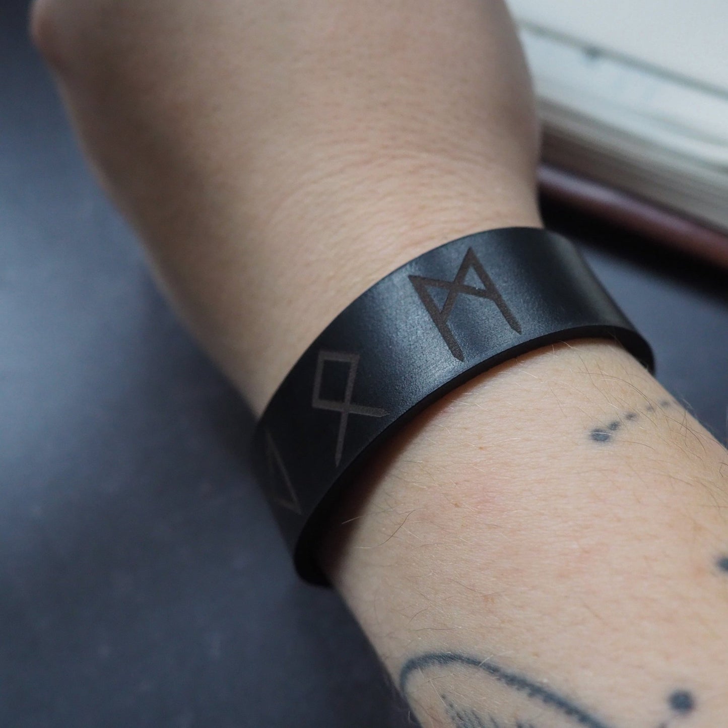 Closer look at the engraving of the Viking Leather Bracelet. Viking Leather Bracelet UK.
