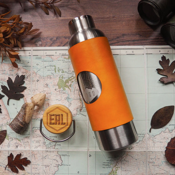 This leather wrapped personalised insulated water bottle is in yellow leather colour and have the lid engraved with a custom initial. Perfect for the gym. 