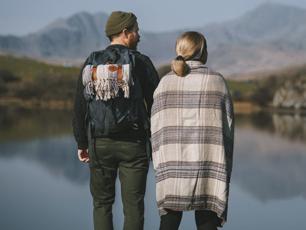 A couple looking out over Welsh mountains