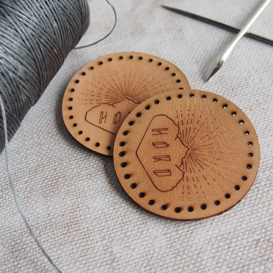  Leather patches with pre-cut holes engraved with the hord logo.