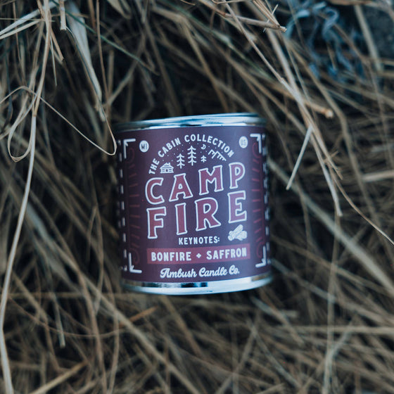 An 8oz paint tin candle with an outdoorsy vibe, featuring the scent campfire. Made from Soy wax.