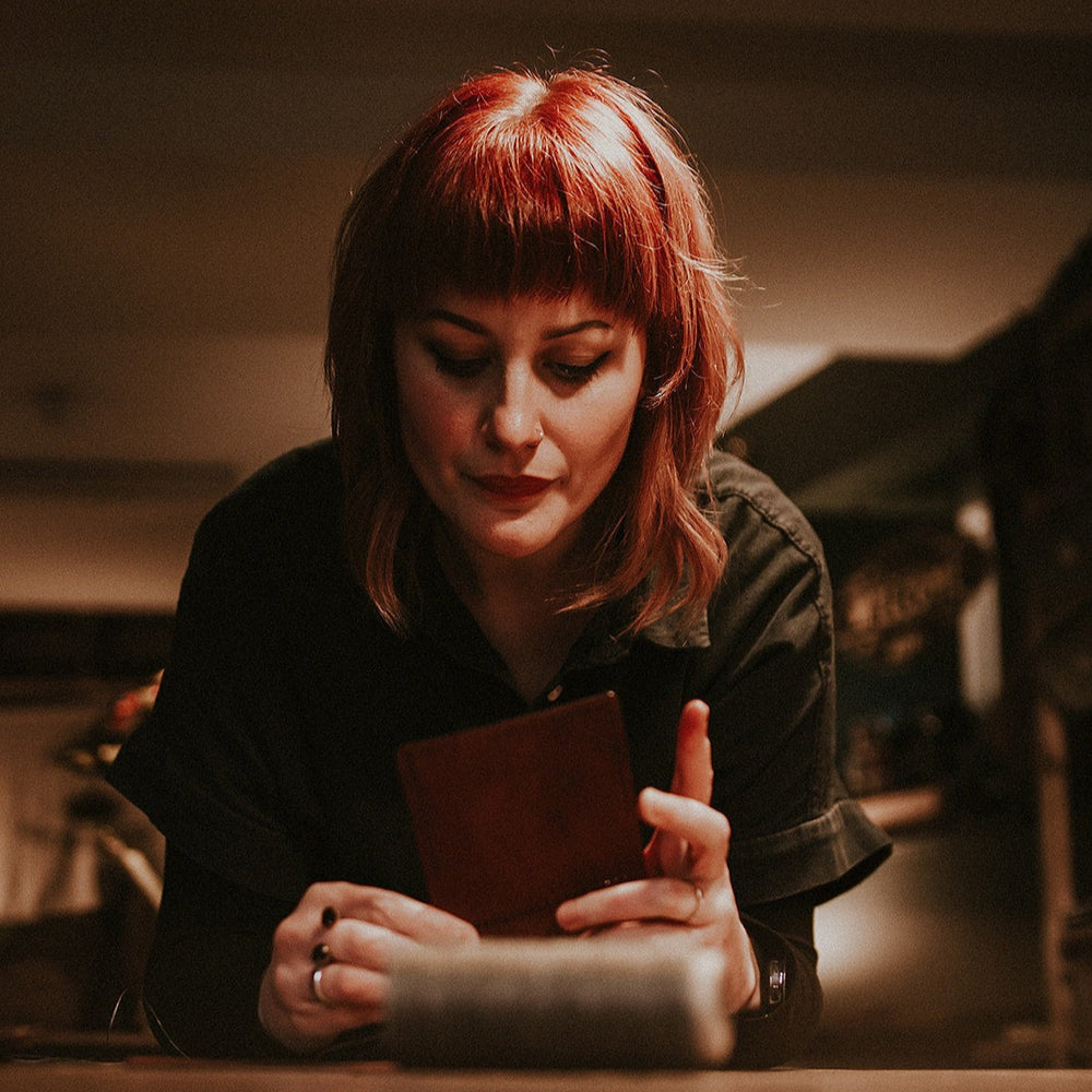 Gemma stitching a wallet in the Hord Shop, Marsden