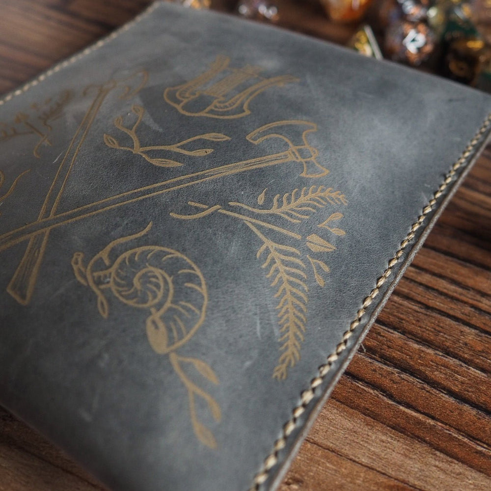 
                  
                    Close up of the back of the dice pouch engraving
                  
                