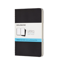 Black Moleskine notebook with dotted paper on a white background