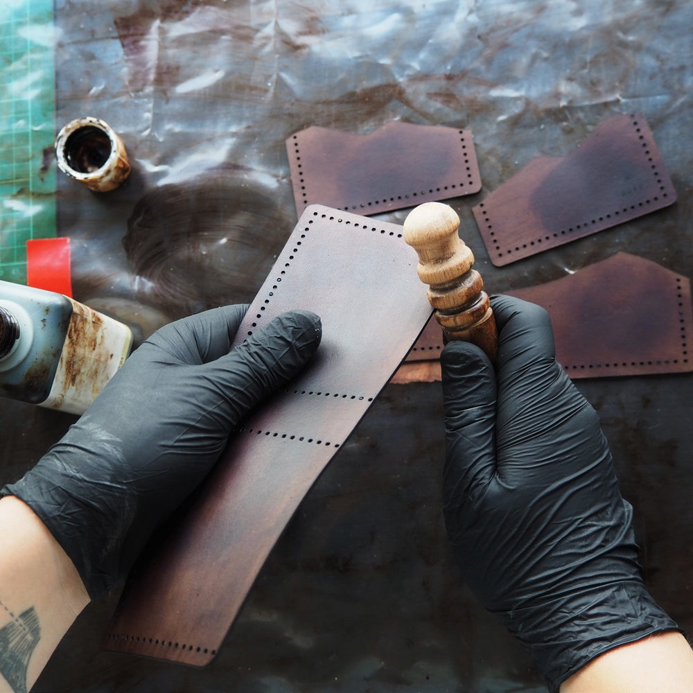 
                  
                    The leather initial wallet being handcrafted at our studio; the Mountain Wallet, Full Size Bi-Fold by Hôrd.
                  
                