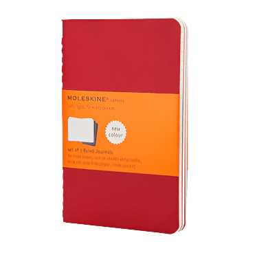 Red Moleskine notebook with orange label on a white background