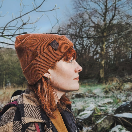 This unisex beanie from HORD, Vegvisir beanie can be worn as a slouchy beanie or folded up as a regular beanie. Pictured is the rust beanie. A comfortable and cosy accessory for colder days.