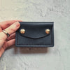 The minimalist wallet, hand stitched and hand dyed, with  our mountain card holder, note section and coin purse. By hord