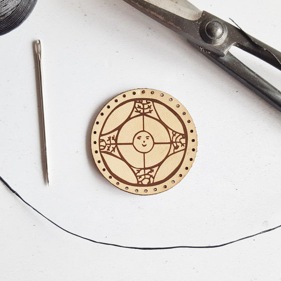 The Angurgapi Leather Patch, a rune patch; natural veg-tan leather patch engraved with Angurgapi - an ancient icelandic stave which is used to stop beer barrels leaking in brewing. By Hord.