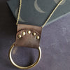 This lunar necklace his crafted with luxurious leather.
