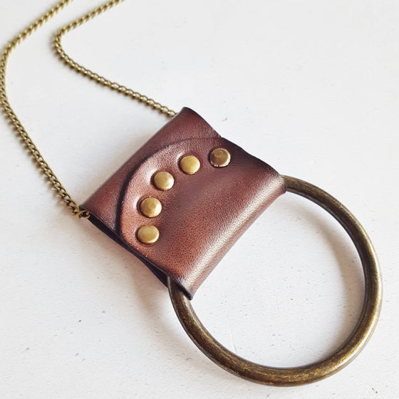 This lunar jewelry is made from luxurious leather.