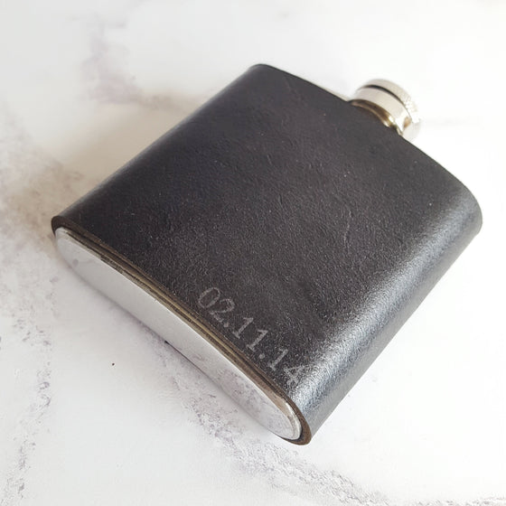 This black leather hip flask has been handcrafted with luxurious leather and personalised on the bottom right corner.