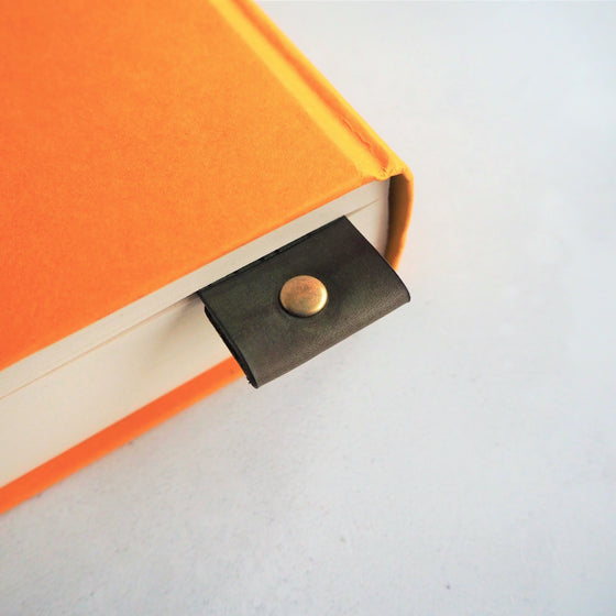 Closer look at the riveted fold of the Custom Leather Bookmark