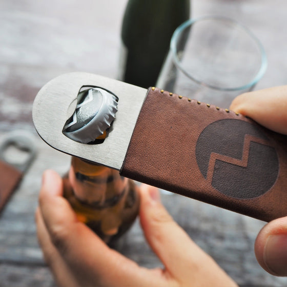 This personalised bottle opener is engraved with a custom logo.