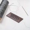 The name patch from Hord comes with pre-cut stitch holes ready to be sewn.