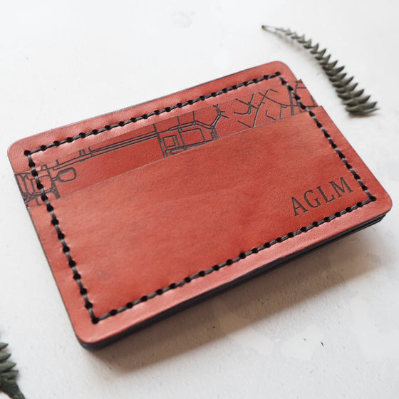 The personalised card holder from Hord with custom road map and initials engraved.