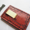 A personalised card holder with a money clip and custom road map engraving.