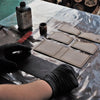 Engraved wallet, the Custom Topography Slim Mountain Wallet being handcrafted in our studio.