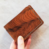 This Custom Topography Slim Mountain Wallet is hand stitched in white linen thread and light brown leather colour.