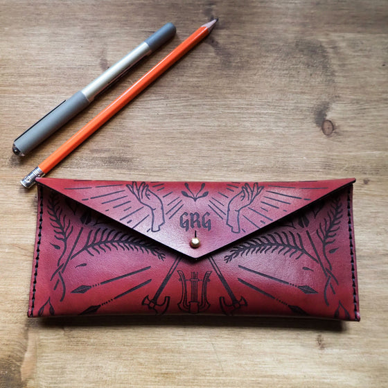 This Dungeoneers Leather Pencil Case has been personalised with a custom initial.