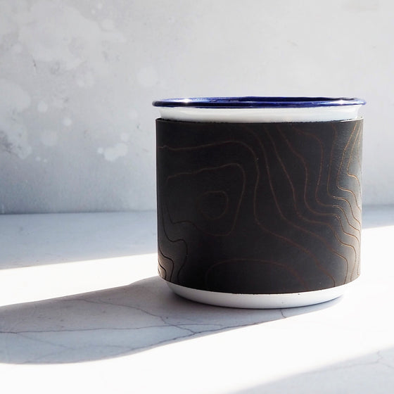 Personalised Map Mug, a custom enamel mug featuring contour lines of a specific place. 