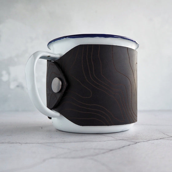 A custom enamel mug offering from Hôrd, featuring the custom topography design. 