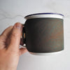 Intricate details of the Mulberry leaf engraving on the camping enamel mug by HÔRD.