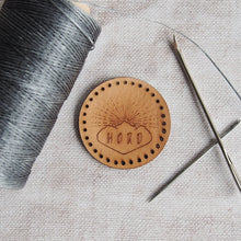  A circular leather patch engraved with the HORD logo so that you can represent your favourite leather brand - us! Stitch holes are ready cut to make sewing this onto your accessories super easy