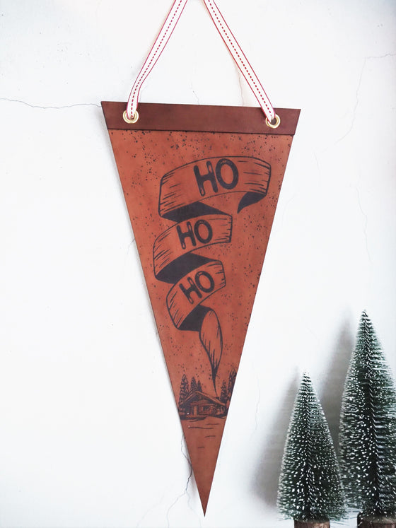 This large Christmas banner is made from luxurious leather and engraved to craft the Ho Ho Ho Banner.