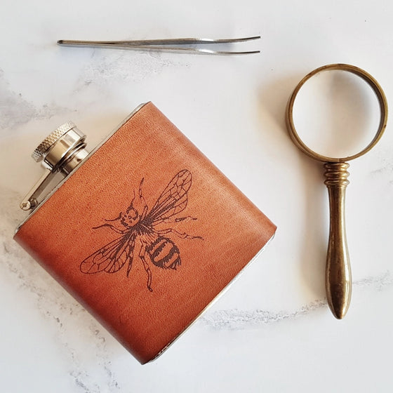 This bee flask is made from luxurious leather that has been clad onto a stainless steel flask.