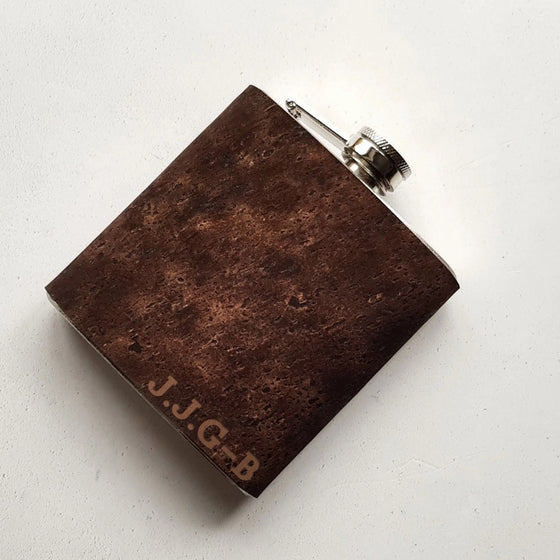 This initial hip flask is made from cork and engraved with a custom initial on the bottom right corner.