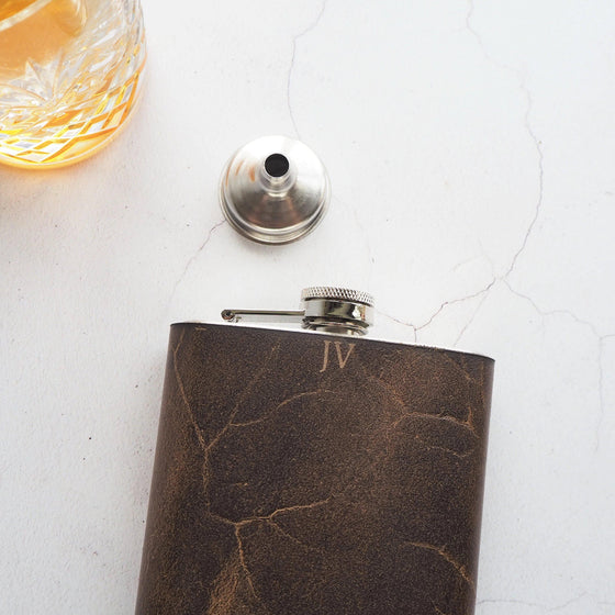 The Initialled Oak Leather Flask can be engraved and thus creating a personalised hip flask for you.