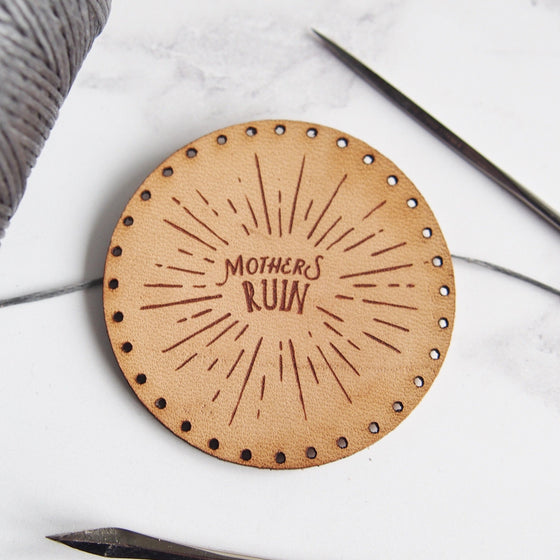 Our Mother's Ruin Sunburst design is engraved onto a circular natural leather patch with pre-cut stitch holes, making it easy for gin lovers to sew it onto their bag, jacket, hat or anything else! The gin patch from Hord.