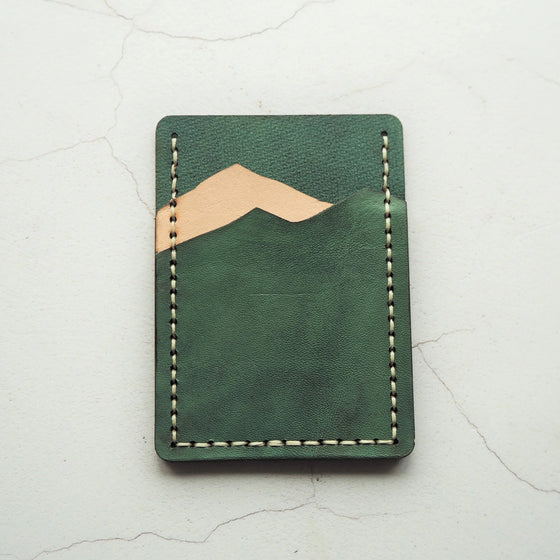Mountain Card Holder - Teal and Natural has two card compartments that celebrates the silhoutte of mountains.