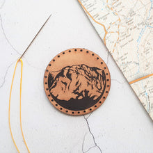  The Mountian Patch by HORD - This leather patch is hand dyed and engraved with wonderful mountains. Perfect stocking fillers or gifts for lovers of the outdoors, mountaineering and hiking.