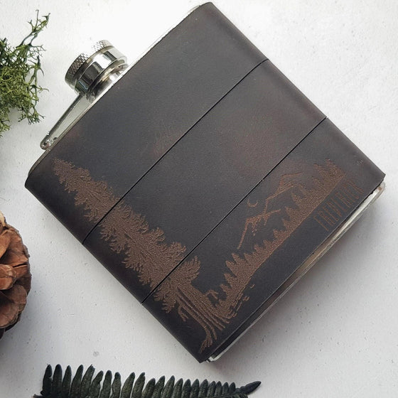 This engraved whiskey flask is handcrafted from high quality leather and clad onto a stainless steel flask.