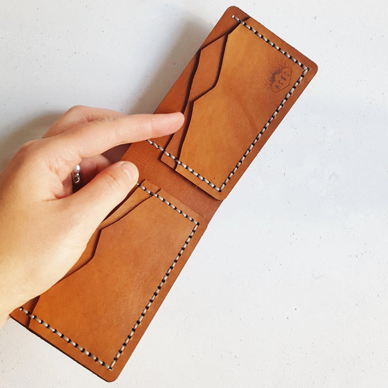 This Mountain Wallet, Slimline Bi-Fold has four card compartments to securely to store all your cards and belongings.