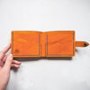 This Mountain Wallet with Clasp has 4 card compartments along with a compartment for cash.