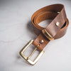 The tan leather belt has been handcrafted using full grain leather.