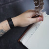 A black Viking Leather Bracelet that has been personalised with custom Runes. Viking Leather Bracelet UK.